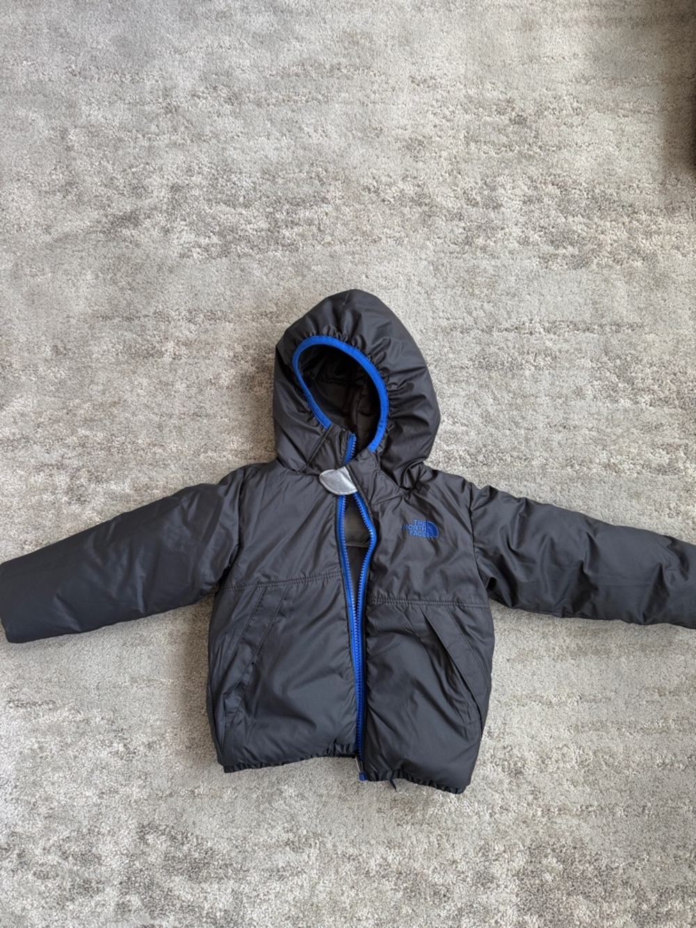 The North Face Kids reversible Black Puffer Jacket with Blue Trim